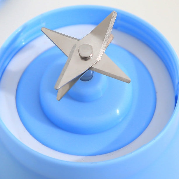 Blue blender jar with stainless steel blades for kitchen use